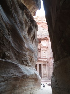 The Treasury, seen through the narrow rock walls of the Siq, not long before sunset