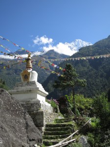 A stupa and Nepalese prayer flags on the trail on day two, on the way to Namche Bazaar