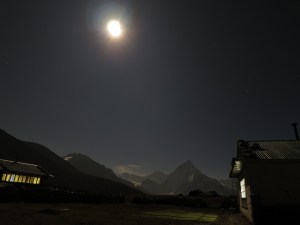 The night sky in Dzonghla, with a beautiful misty mountain backdrop dimly illuminated by the moonlight