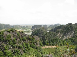 The view across the rice paddies and among the limestone karst towers from the top of one of those towers, above Bích Động Pagoda The view across the rice paddies and among the limestone karst towers from the top of one of those towers, above Bích Động Pagoda