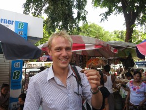 About to sample a tasty, tasty cricket, bought from a street seller in central Yangon