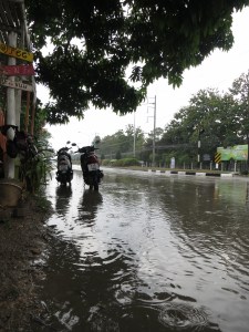 Our scooters, standing in an extended puddle of water otherwise known as the road, as we wait for the deluge to ease on our ride back from Pai to Chiang Mai
