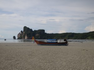 A longtail beached in Loh Da Lum Bay, Ko Phi Phi Don, at low tide