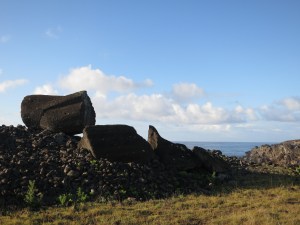 A moai lying broken on its ceremonial platform – this one Ahu Tetenga – near the shore