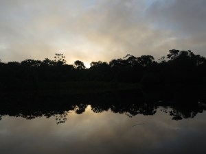 Dawn on a beautifully still river by Buenos Aires village