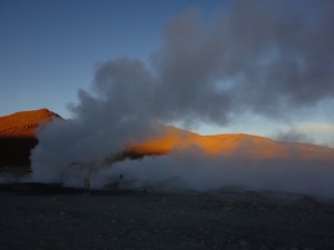The colours of sunrise at a geyser in the desert in southern Bolivia